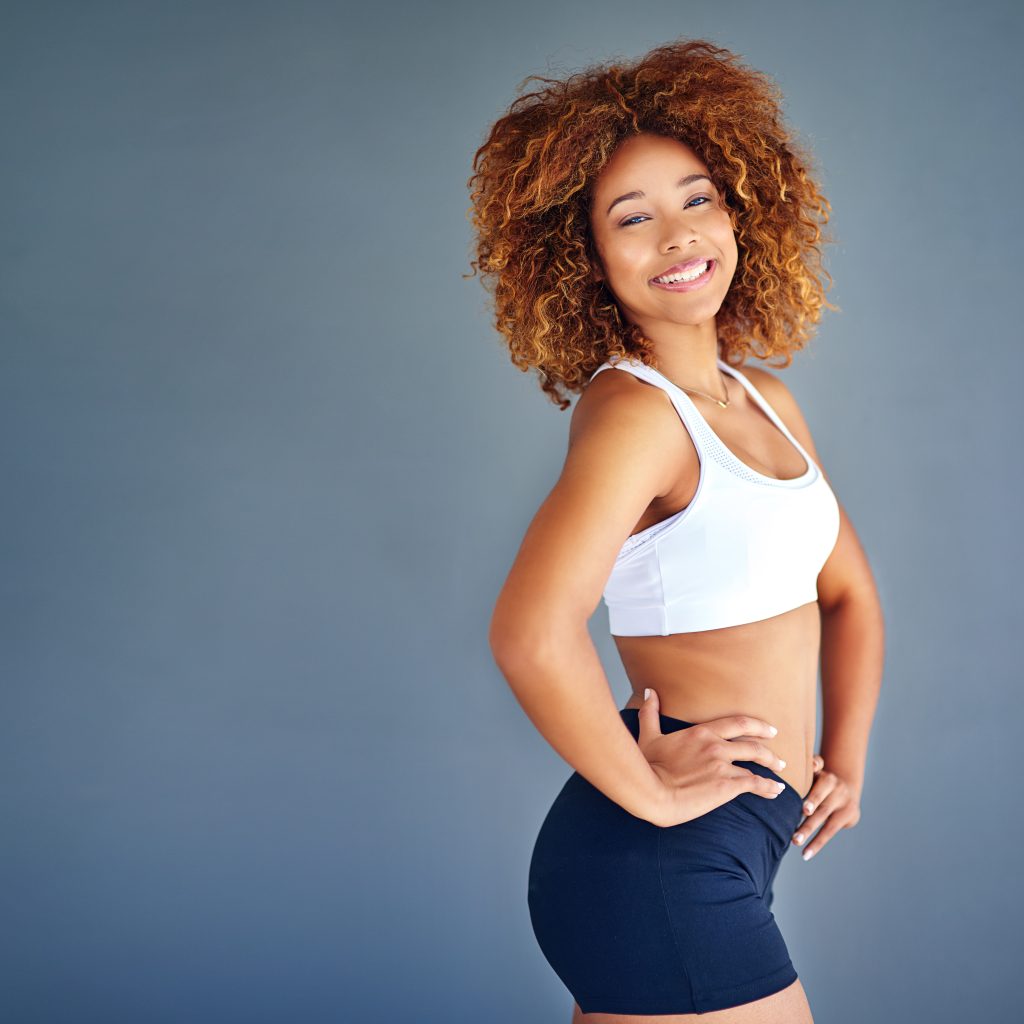 smiling woman poses in fitness attire 2026 09 22 06 26 27 utc